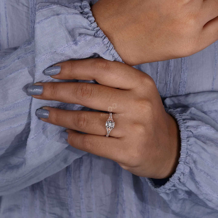 Unique engagement ring featuring a pave diamond ring design paired with a cushion cut diamond elongated style.
