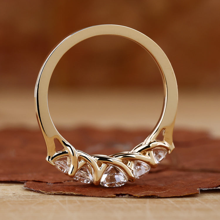 Five stone diamond wedding band in yellow gold
