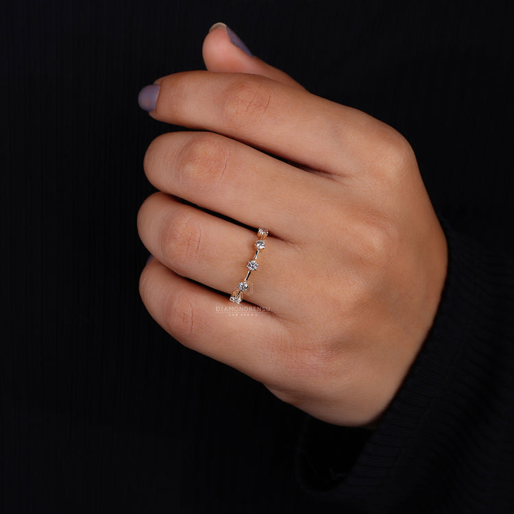 Round diamond wedding band with claw prong setting
