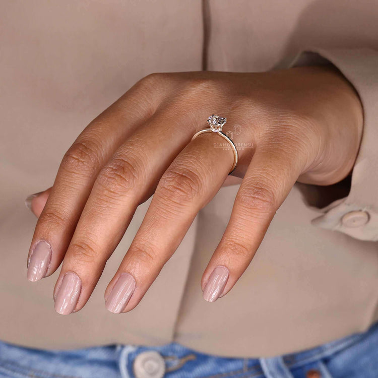 4 prong diamond ring designed with a heart shaped diamond and handmade jewellery details for unique charm.