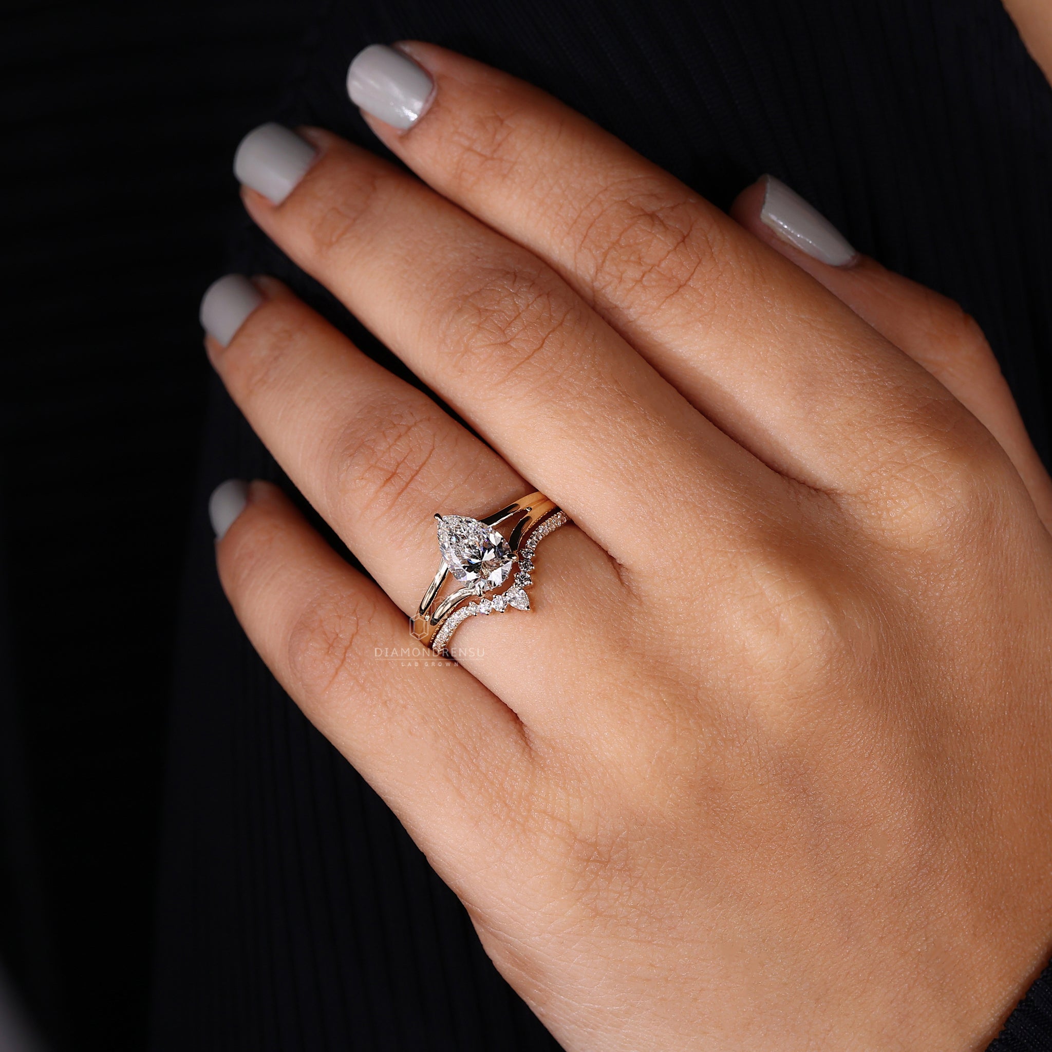 Pear and round diamond ring set.
