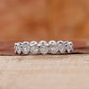 Bezel set eternity wedding band in white gold.
