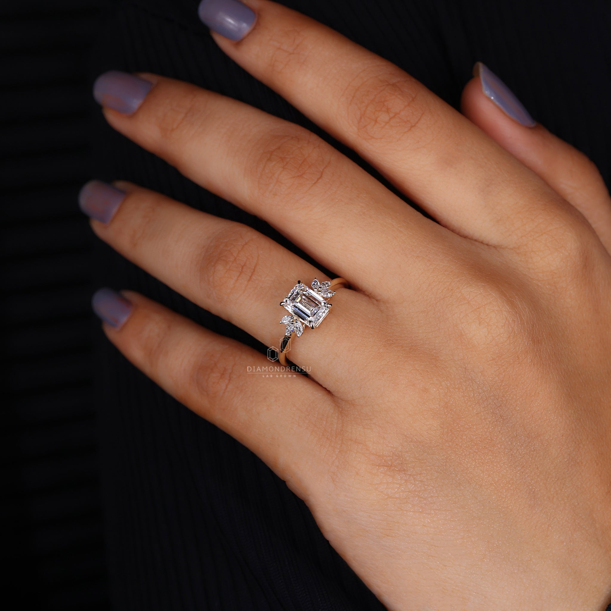 Marquise diamond accents on gold engagement ring.

