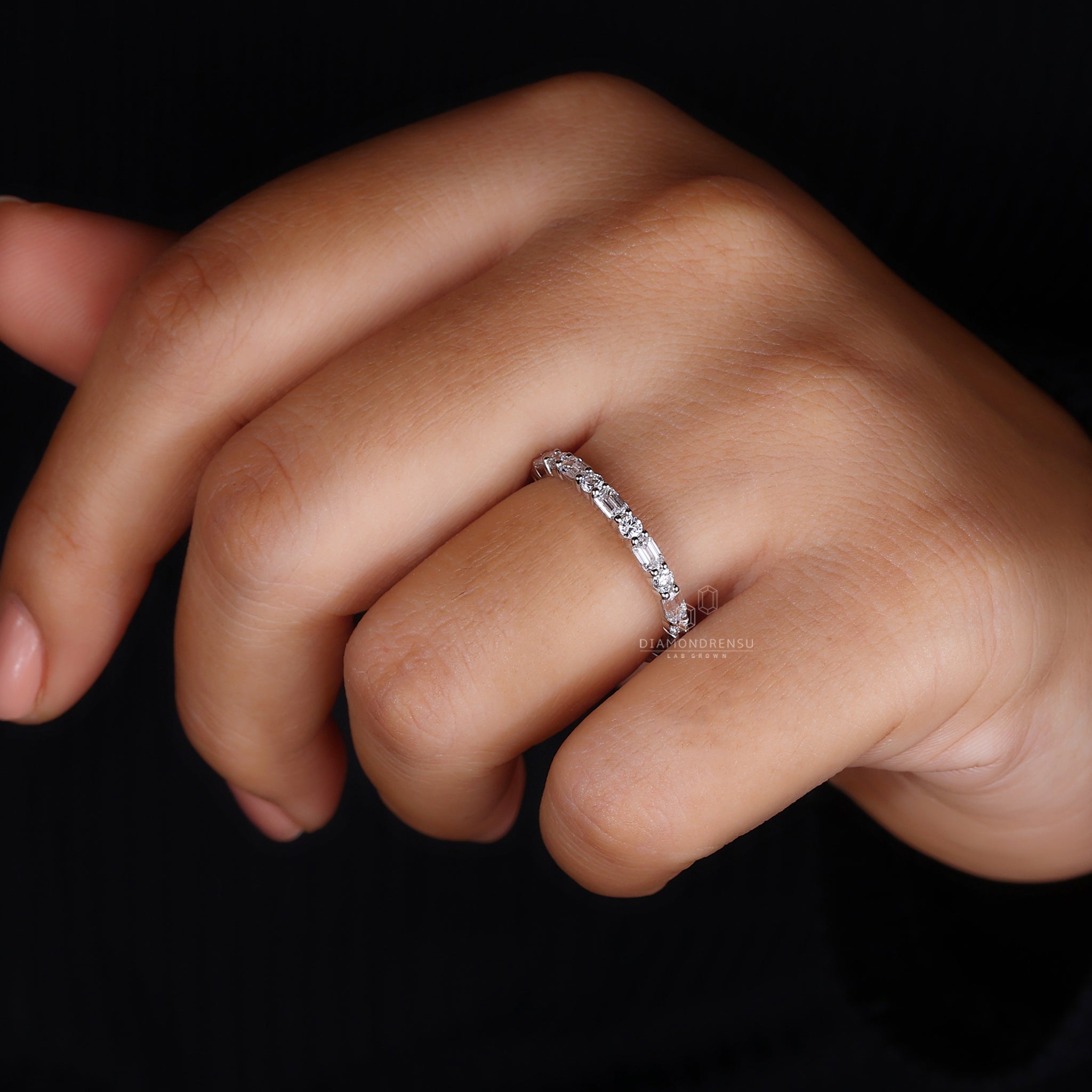 Round and emerald cut lab diamond ring.
