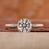 Round cut diamond ring with sparkling stones.

