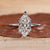 Hidden halo engagement ring with Dutch marquise diamond ring.
