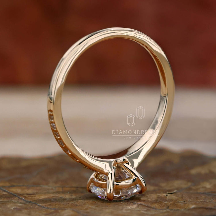 Pave diamond ring crafted with a 4 prong claw setting and a round brilliant cut diamond for lasting brilliance.
