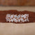 Two row diamond wedding band with marquise and round diamonds.
