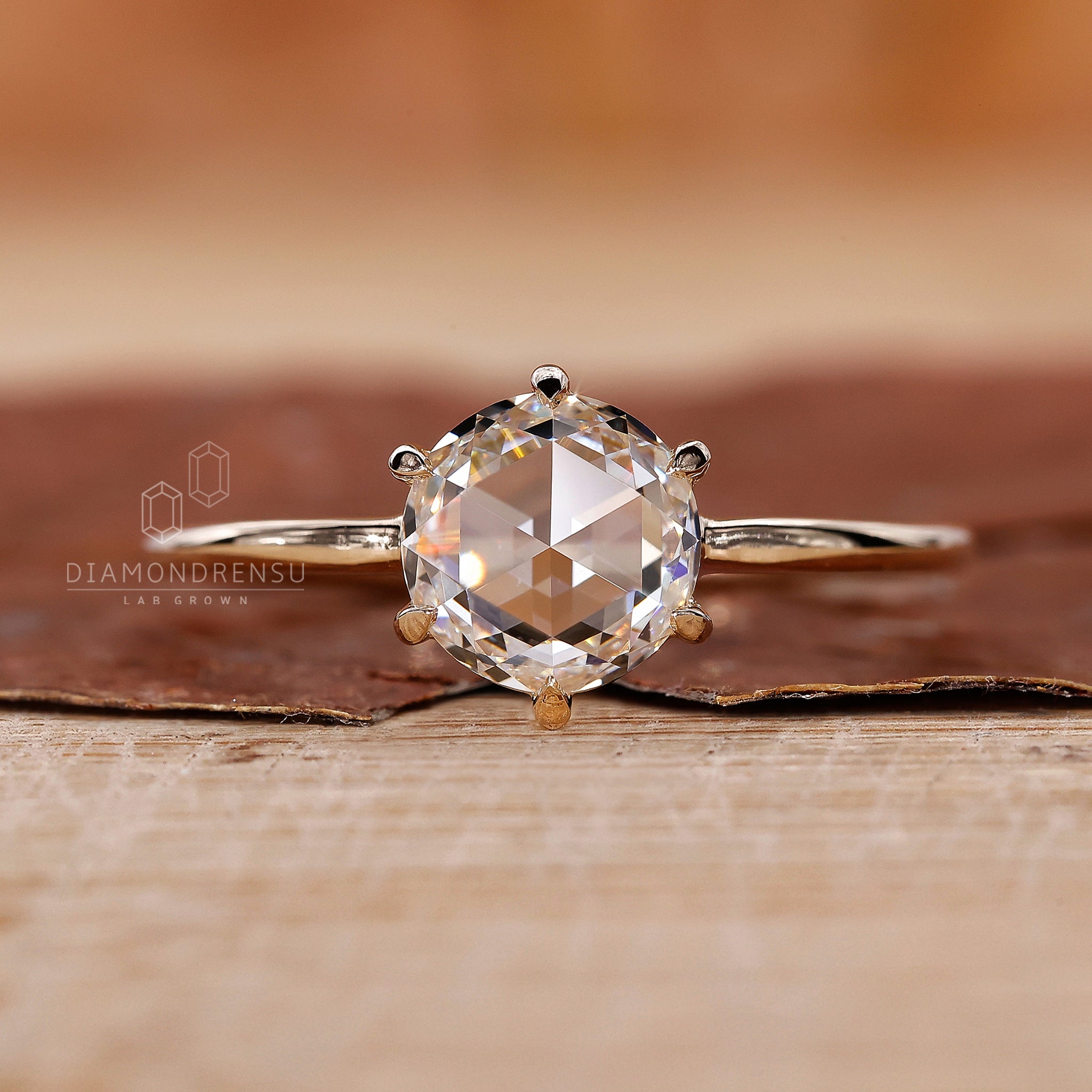 Solitaire engagement ring with a 6 claw prong setting.
