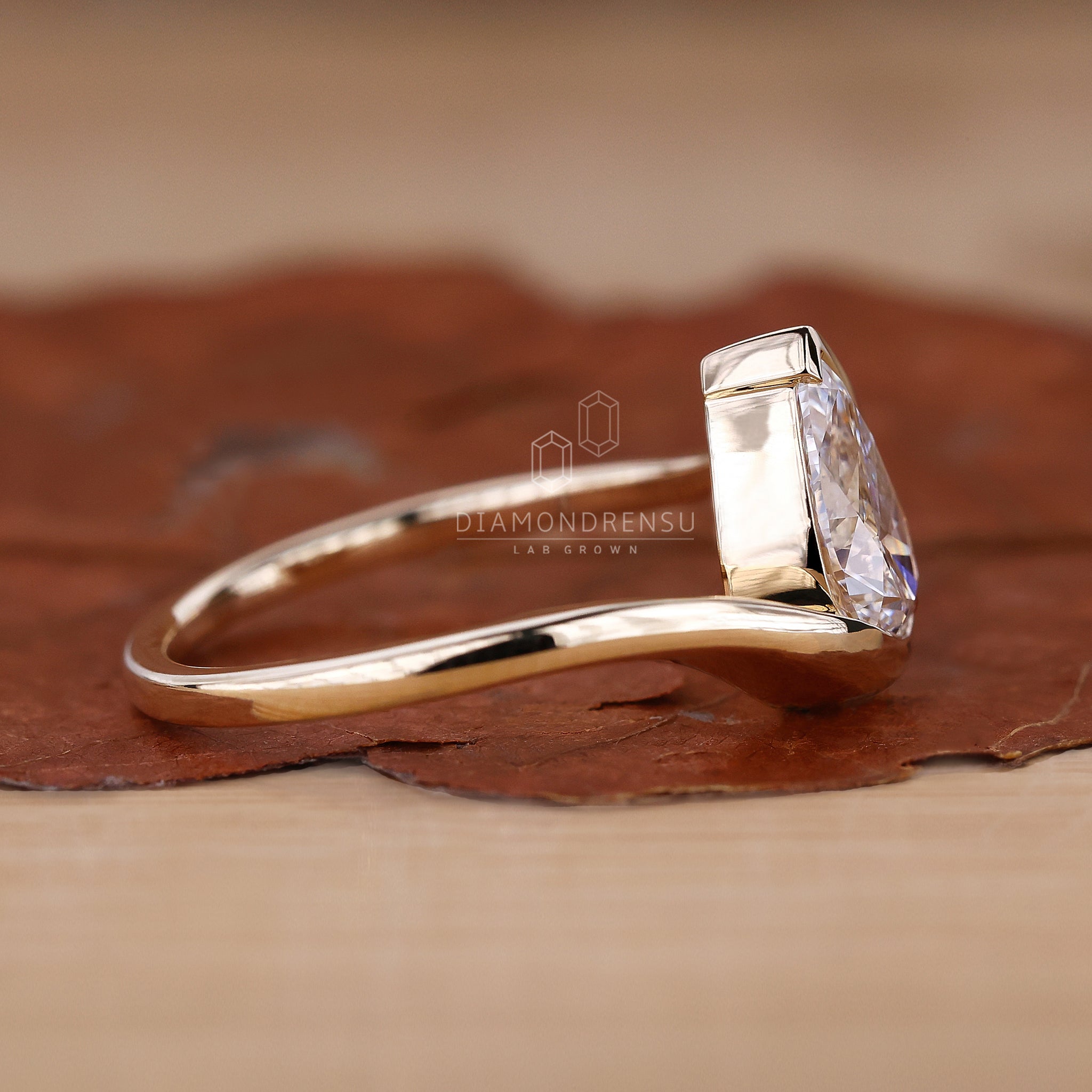 Solitaire ring featuring a pear cut lab grown diamond.