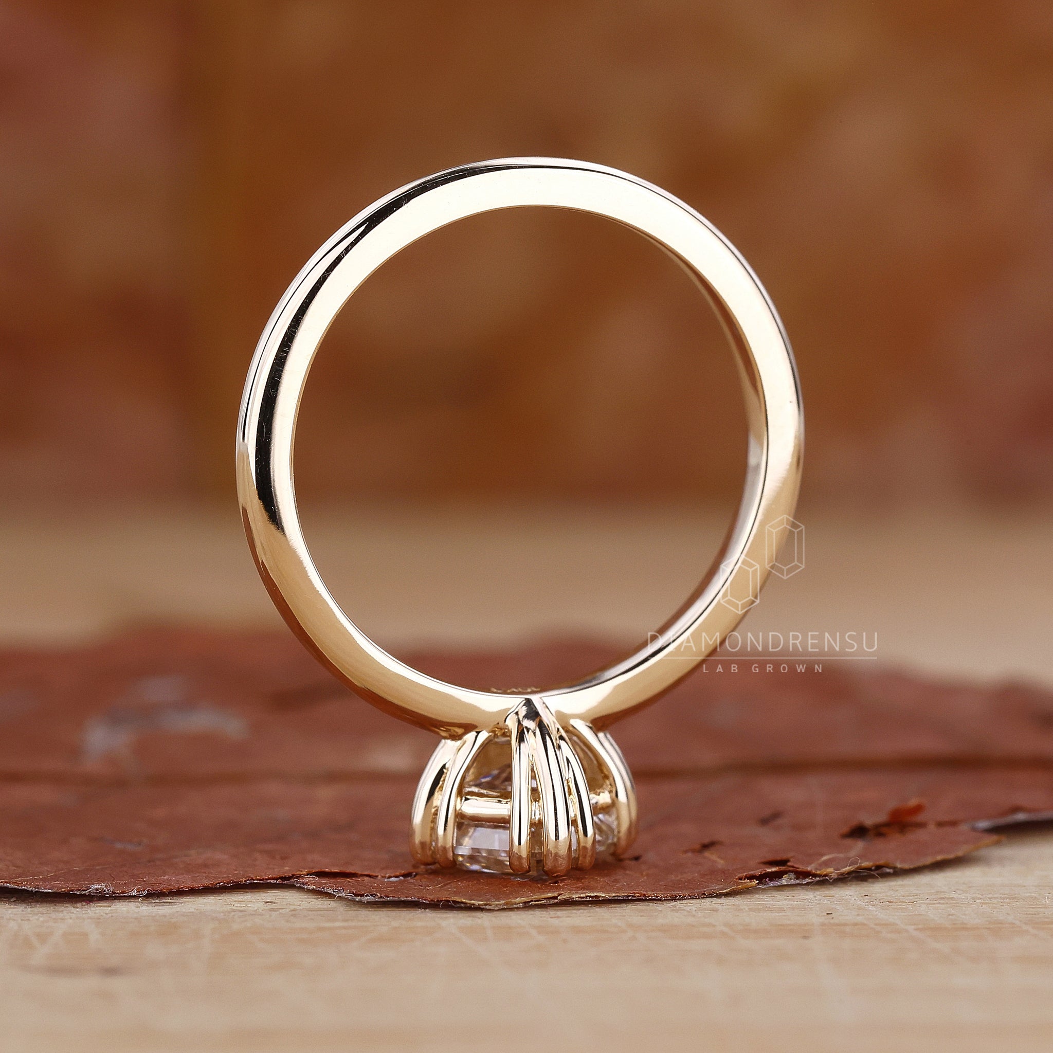 UK engagement ring in solitaire gold design.
