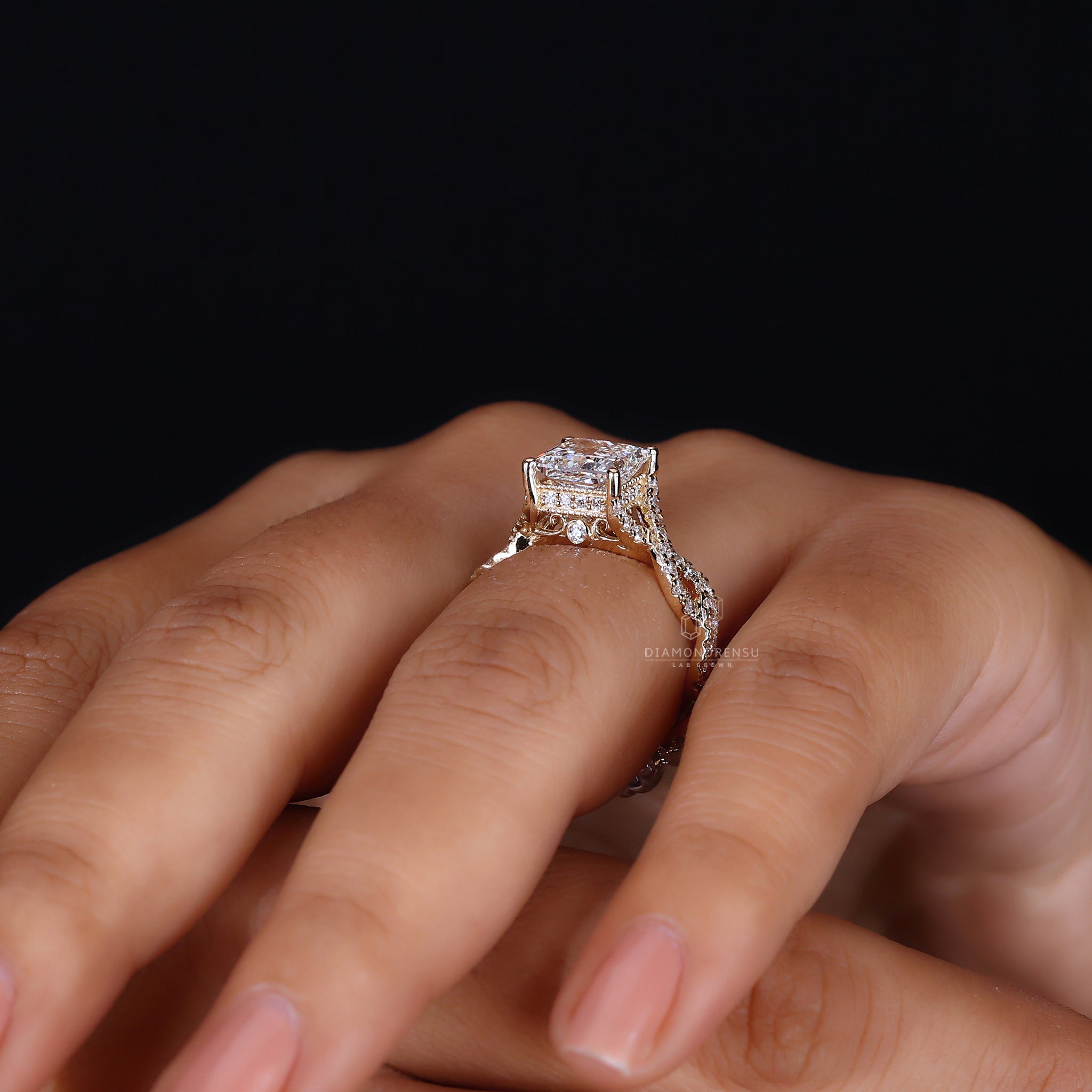 Hidden halo engagement ring is placed under the princess cut diamond.
