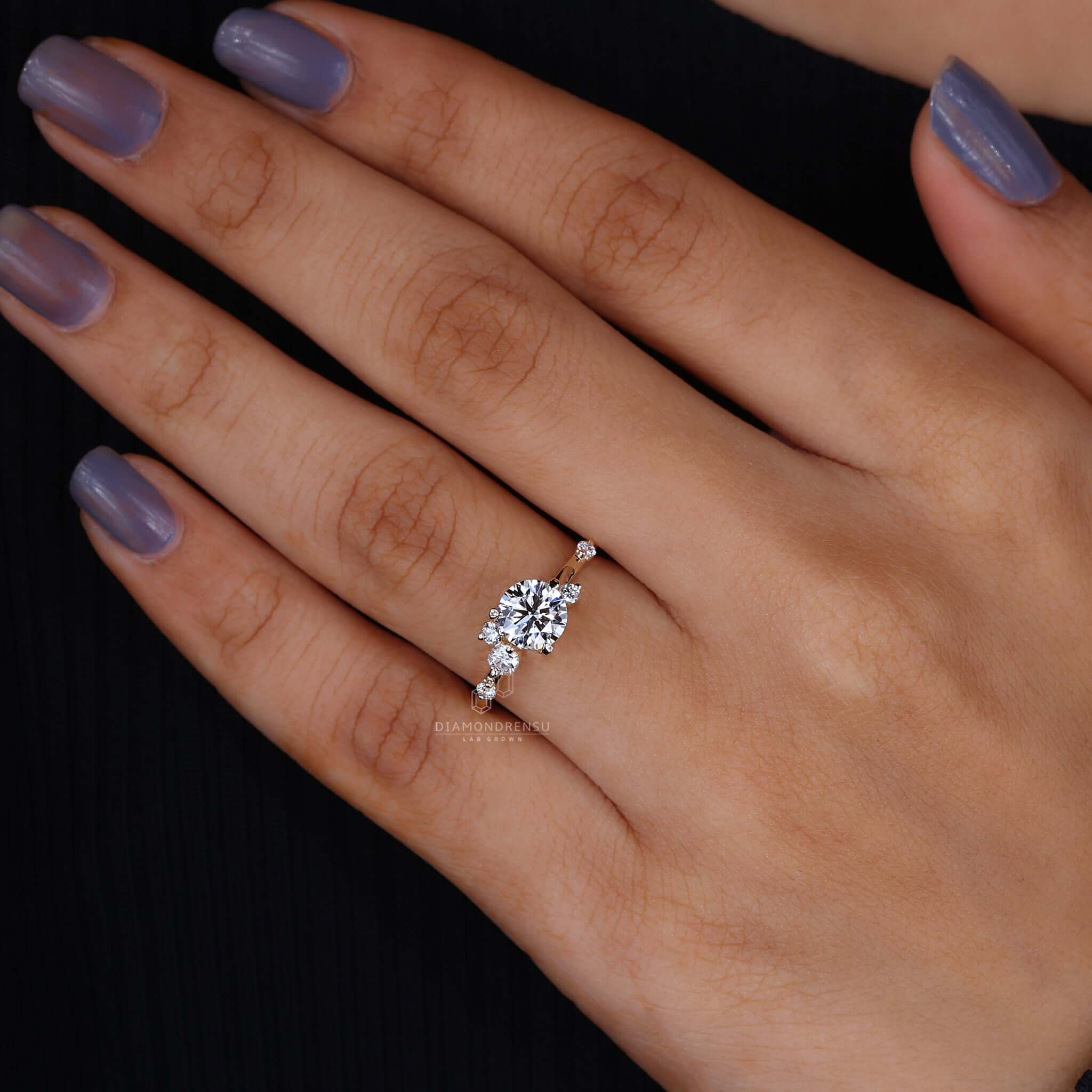 Close-up of a diamond cluster ring on hand, showcasing its dazzling array of stones and craftsmanship