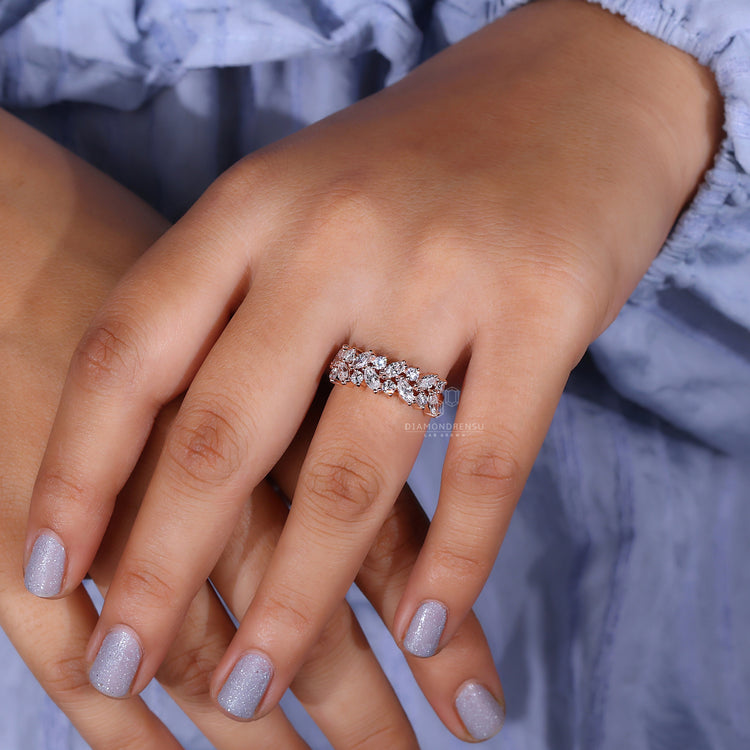 Half eternity wedding band with marquise and round diamonds.
