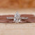 Pear shaped diamond ring with tapered pave engagement ring.
