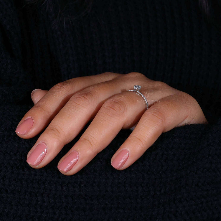 Pave ring designed with a Lab Grown Diamond in a hidden halo setting for an environmentally friendly engagement option.
