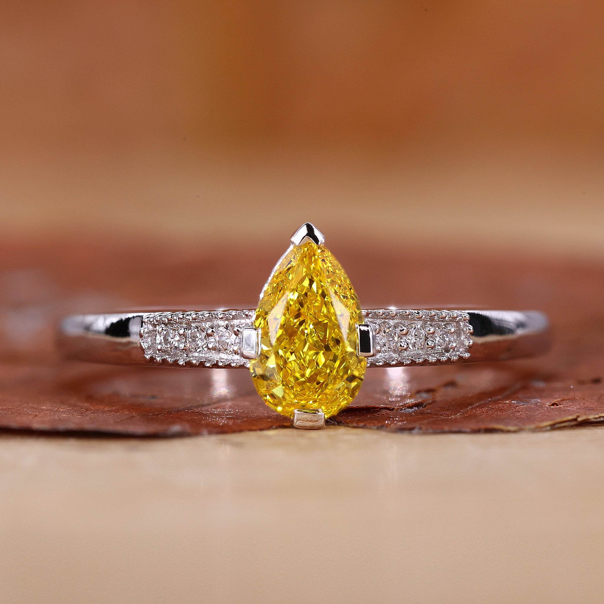 Yellow pear diamond ring with pear diamond engagement ring.
