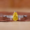 Yellow pear diamond ring with pear diamond engagement ring.
