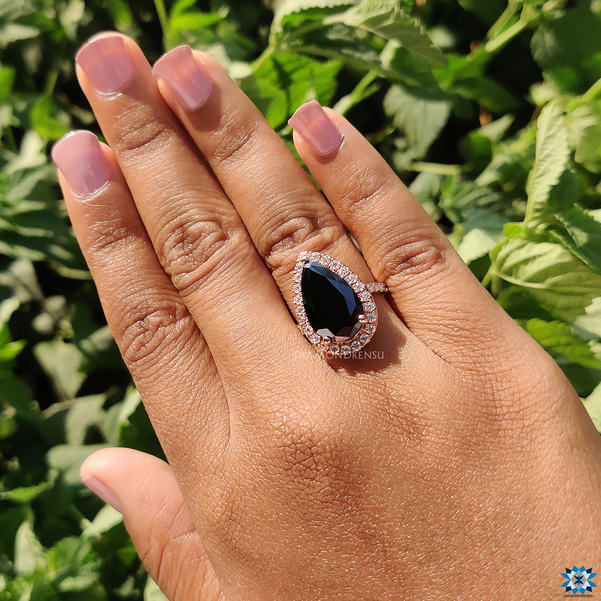 Moissanite for an engagement ring in UK with black pear cut stone.
