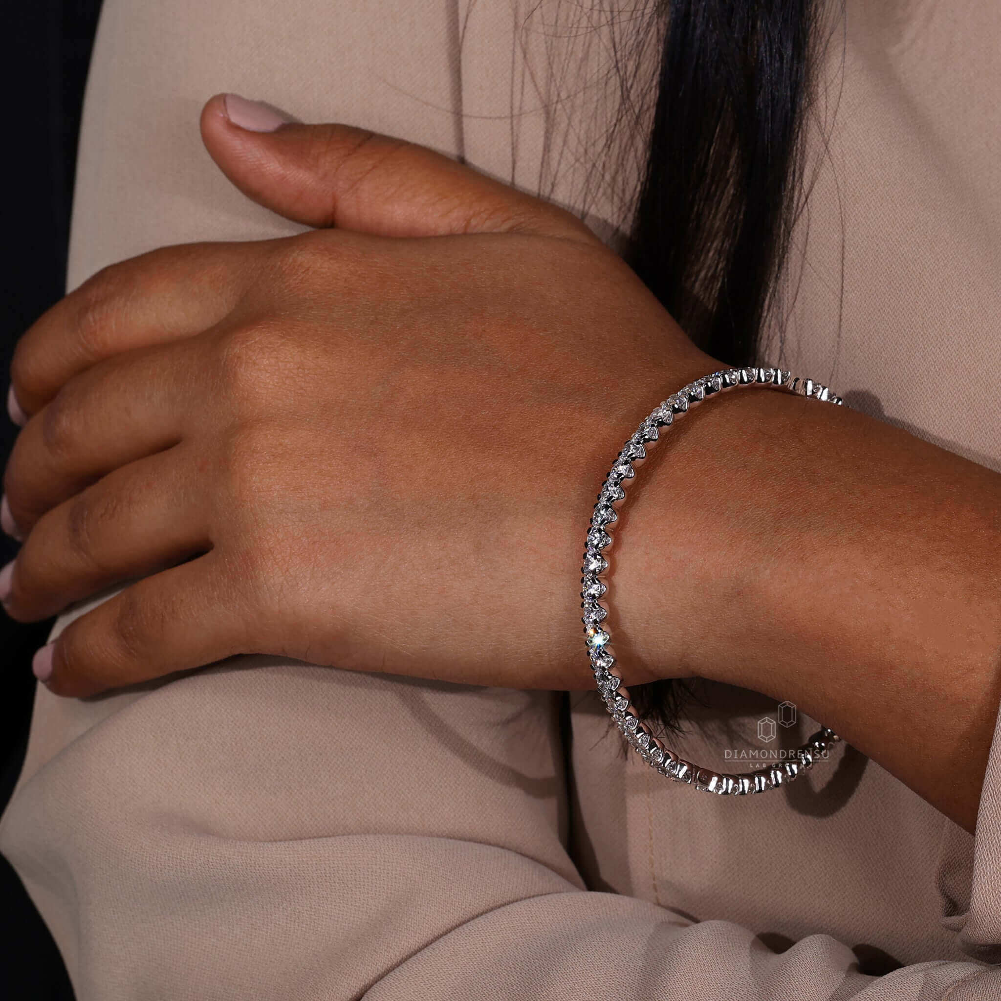 Stylish diamond bangle bracelet on model's wrist