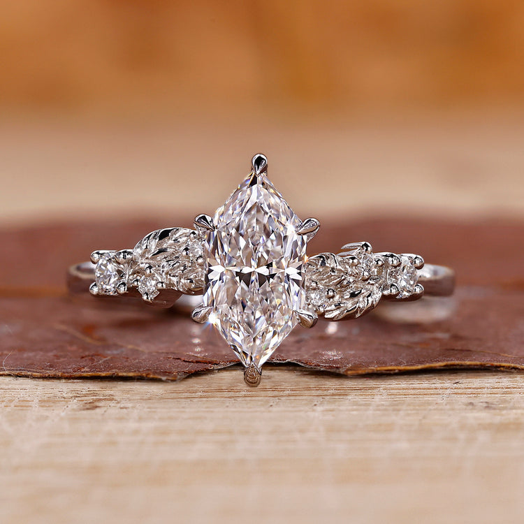 Dutch marquise diamond ring with muse setting in white gold.
