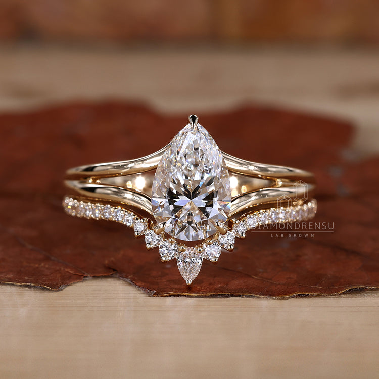 Curved wedding band for pear ring.
