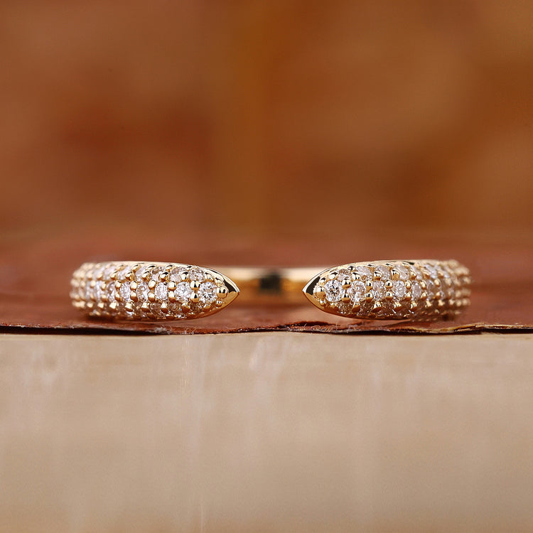 Three row pave diamond band in yellow gold.
