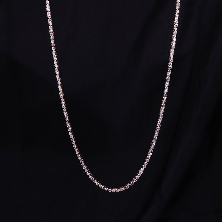 Diamond tennis necklace crafted in rose gold with round diamonds.
