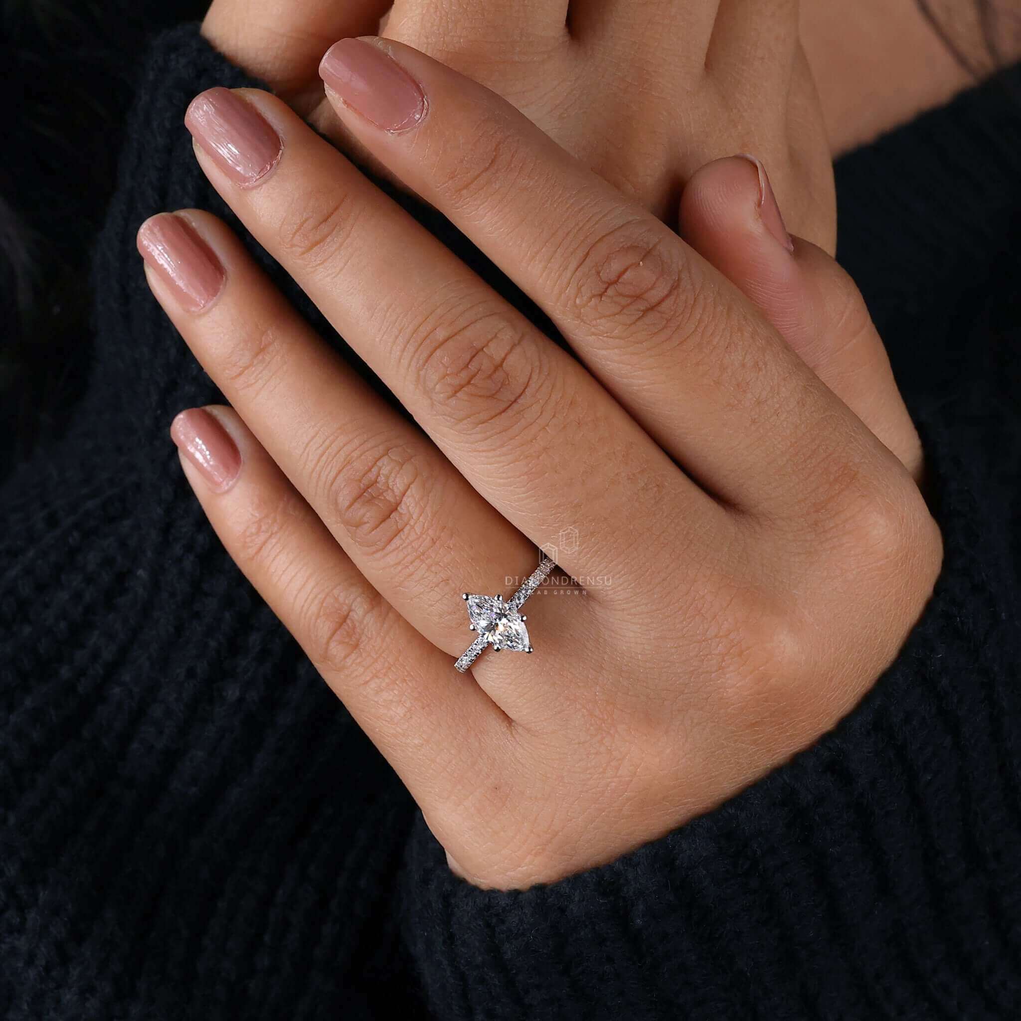 Marquise cut diamond ring in a handcrafted design, perfect for engagements.