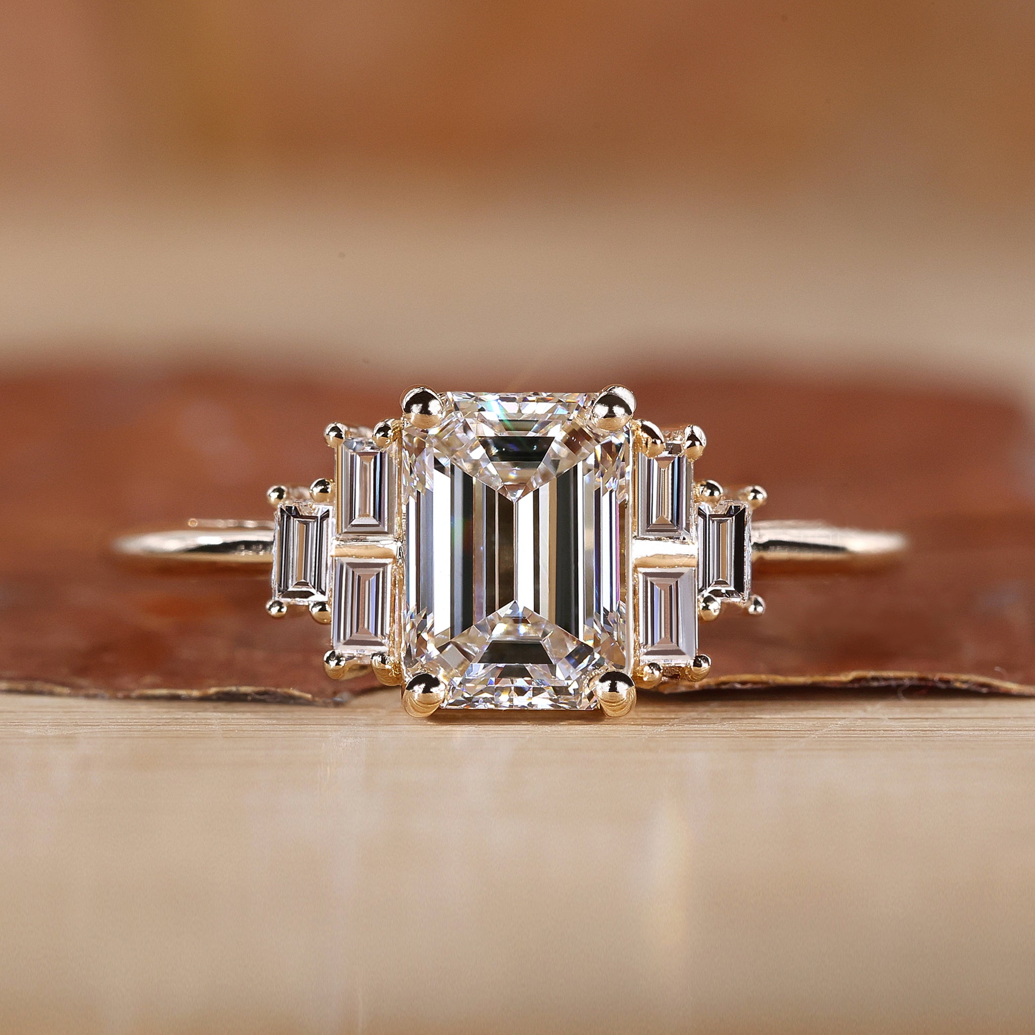 Emerald cut engagement ring with seven stone diamond ring.

