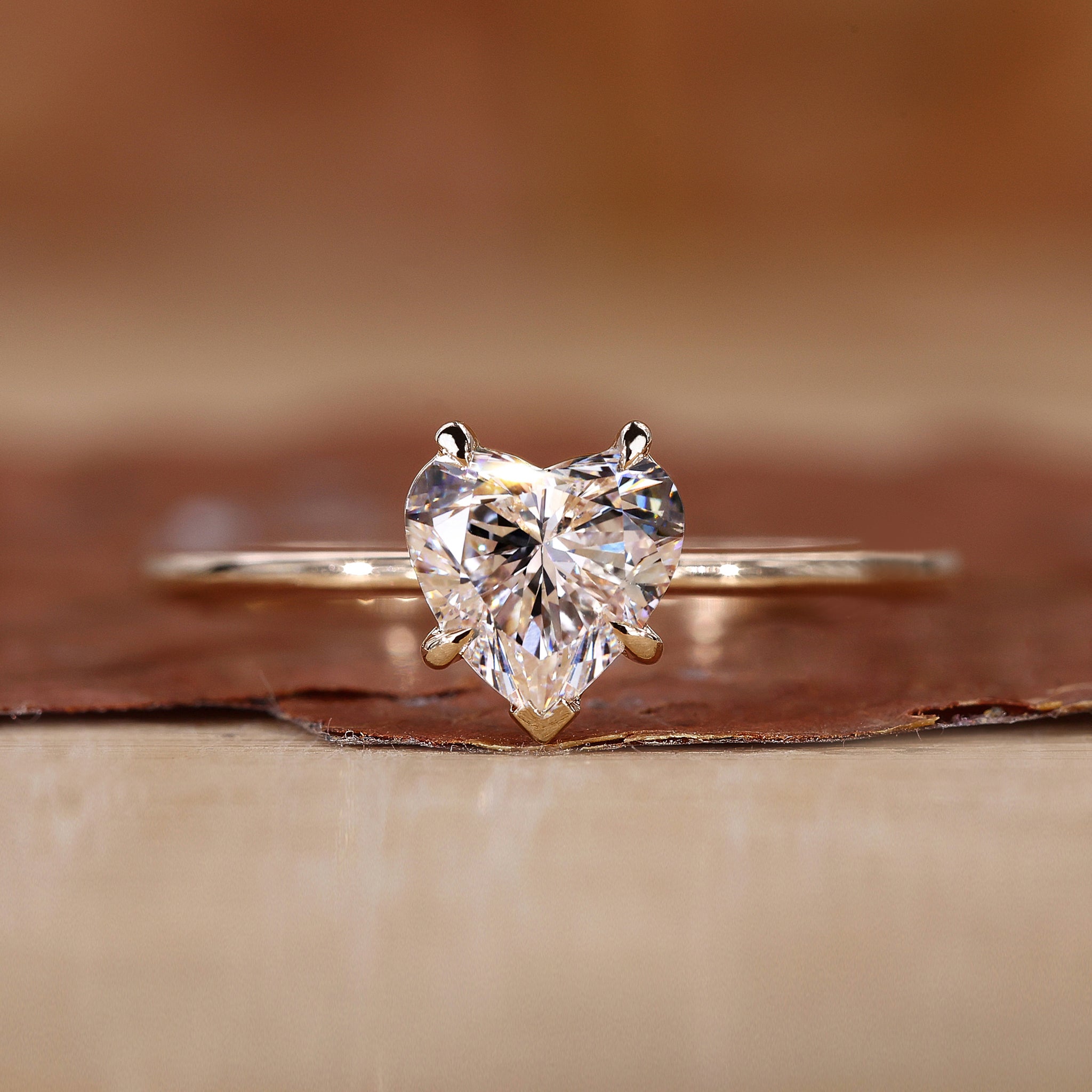 Heart shaped diamond ring in yellow gold.
