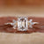 Emerald cut diamond ring in yellow gold setting.
