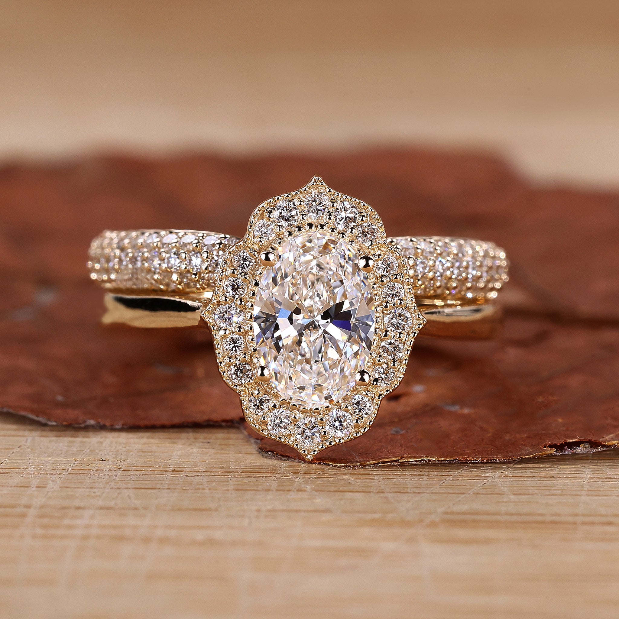 Oval diamond engagement ring with band.
