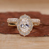 Oval diamond engagement ring with band.
