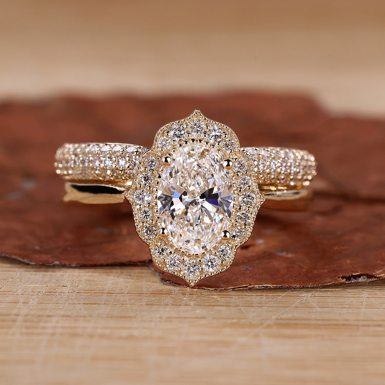 Oval diamond engagement ring with band.
