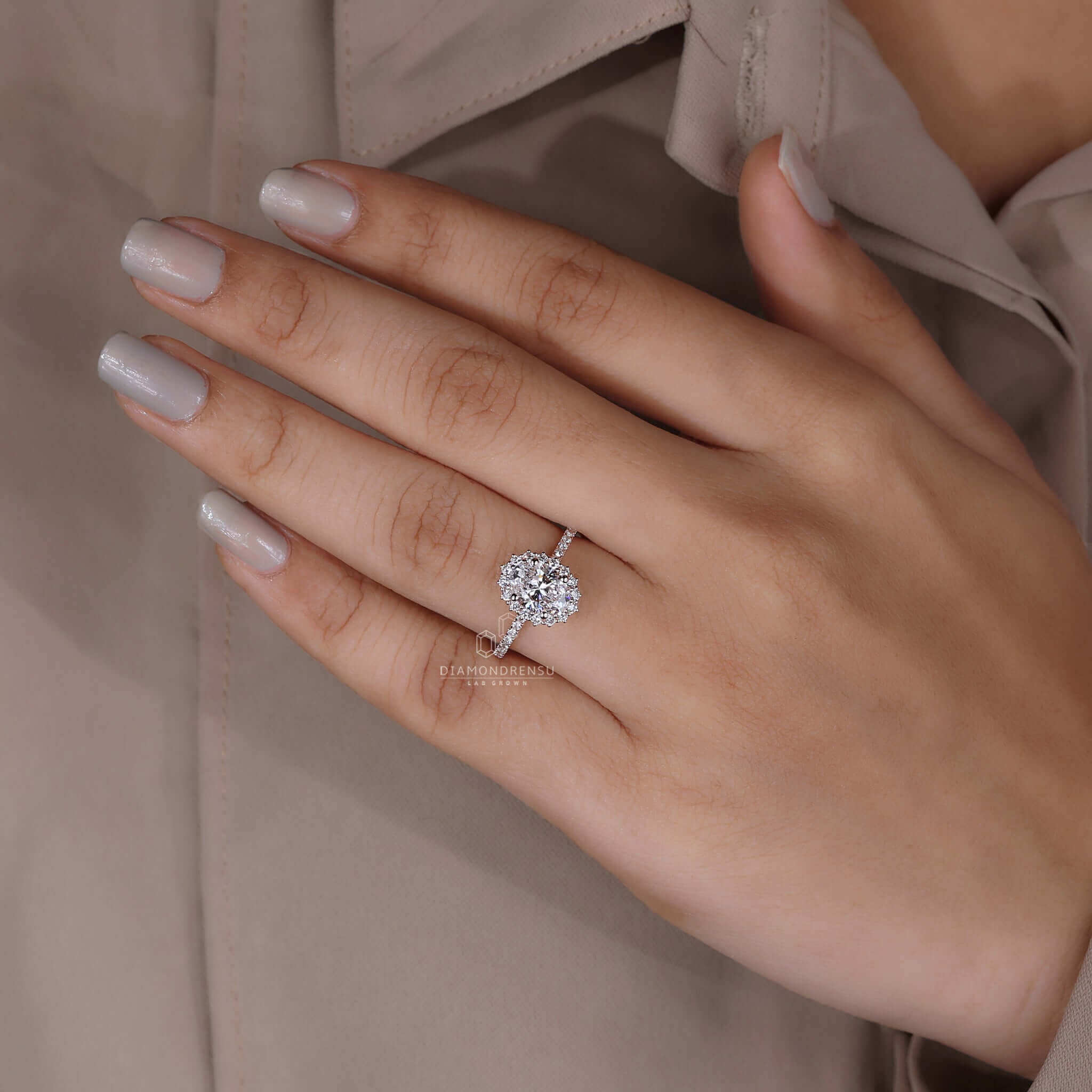 Classic halo ring with a beautifully cut oval diamond for a sophisticated engagement.