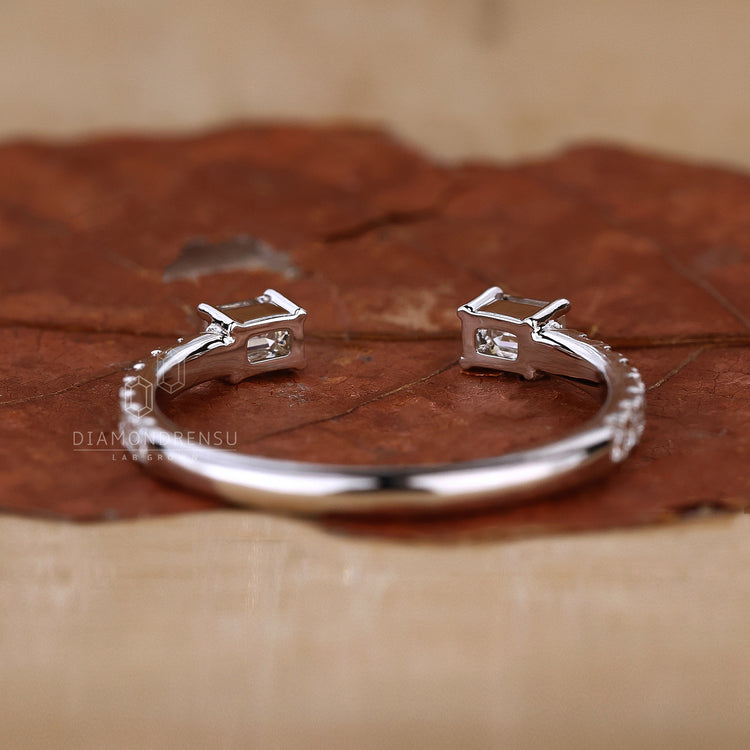 Lab grown emerald cut diamond wedding band with prong setting
