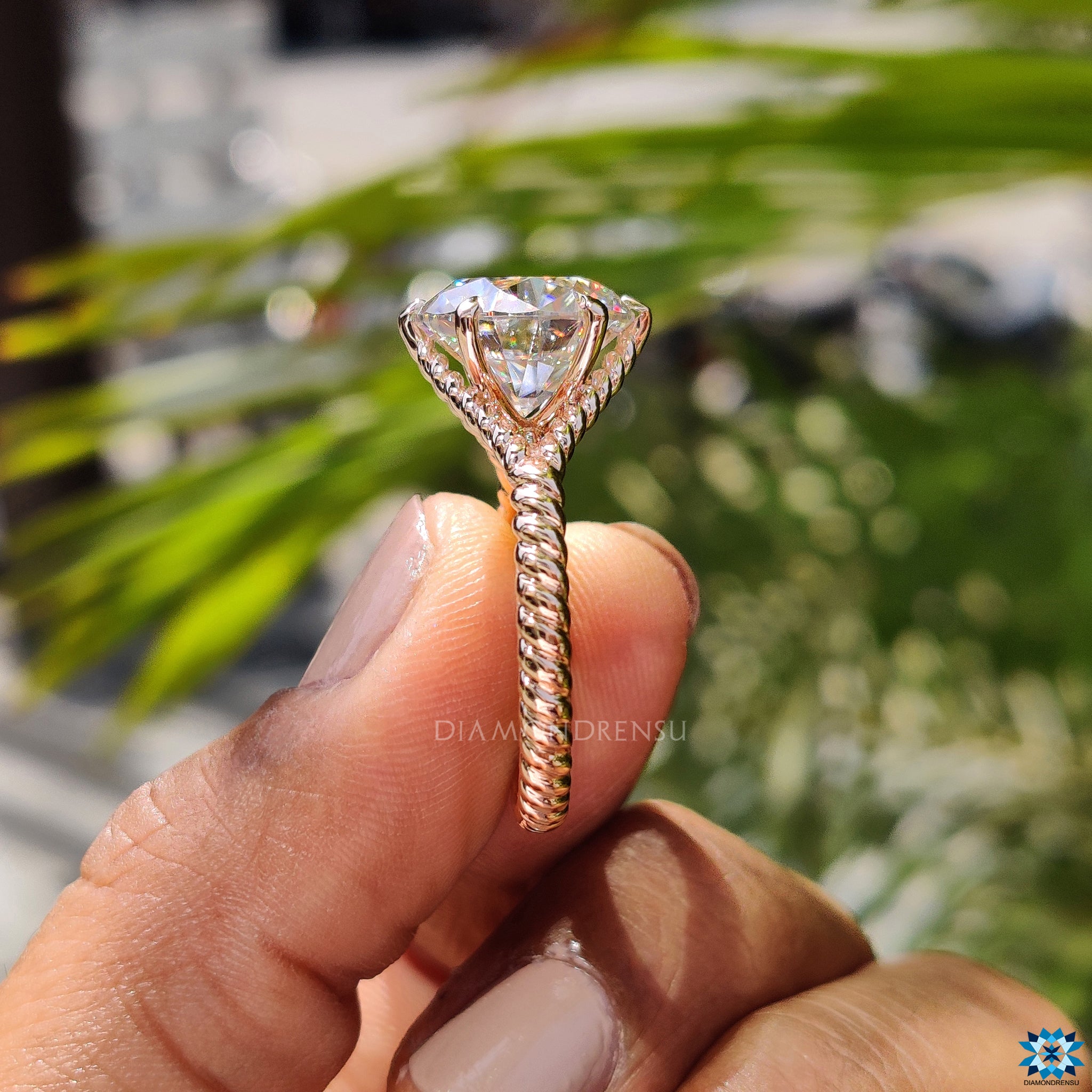 Elegant rose gold solitaire ring with brilliant round moissanite centre.
