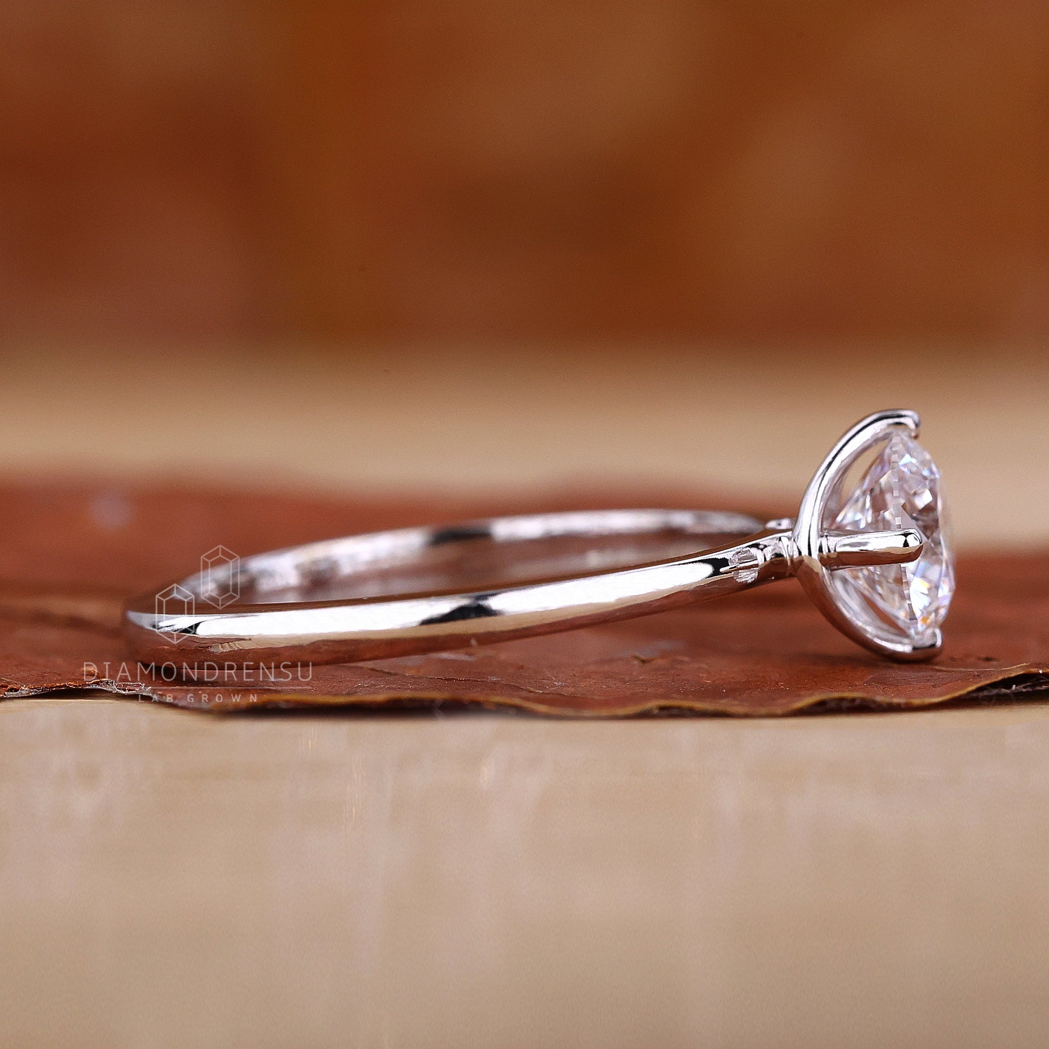 White gold engagement ring with round cut.
