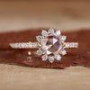 Halo Diamond Ring with a brilliant centre stone and delicate halo of diamonds.