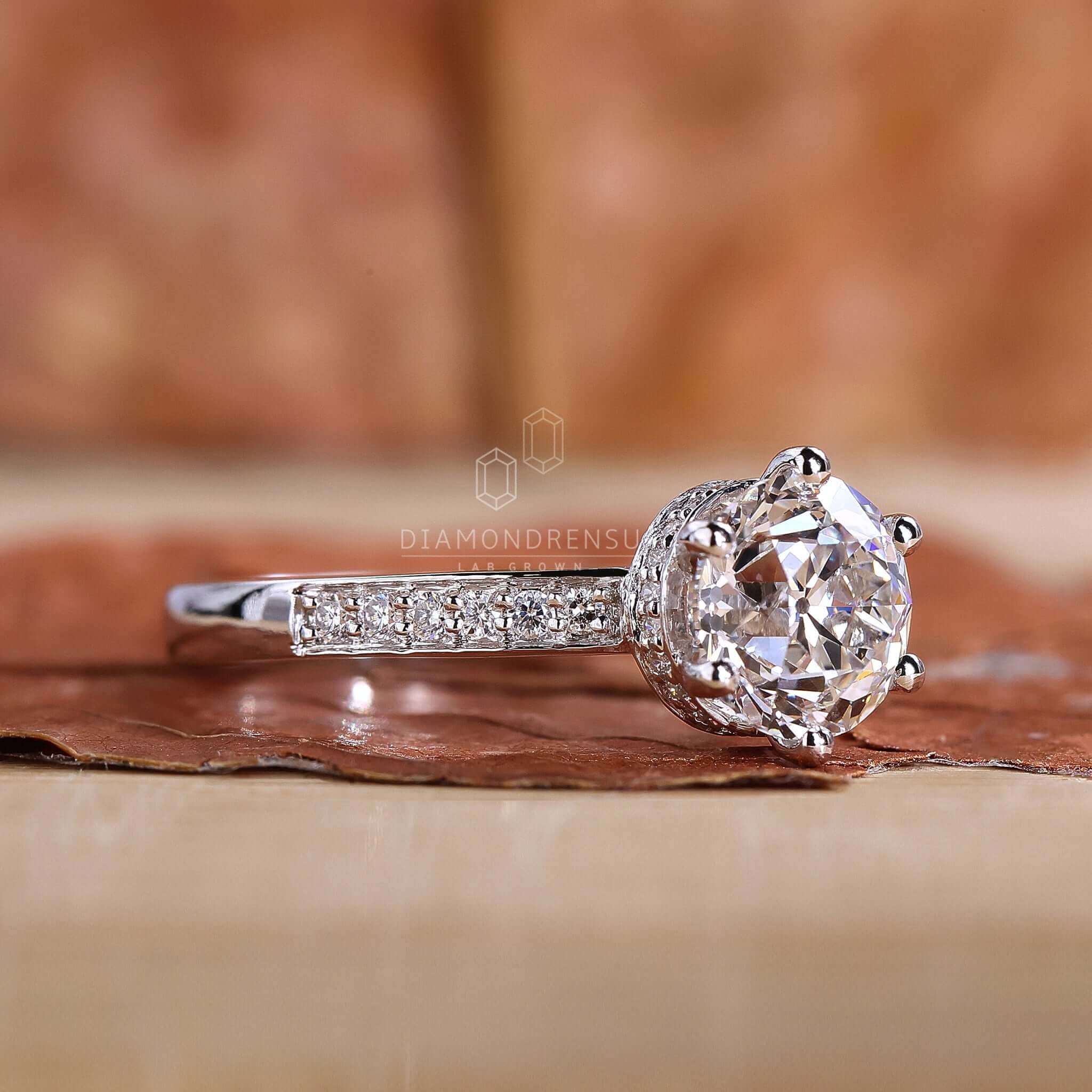 Pave diamond ring with intricate detailing for added sparkle.