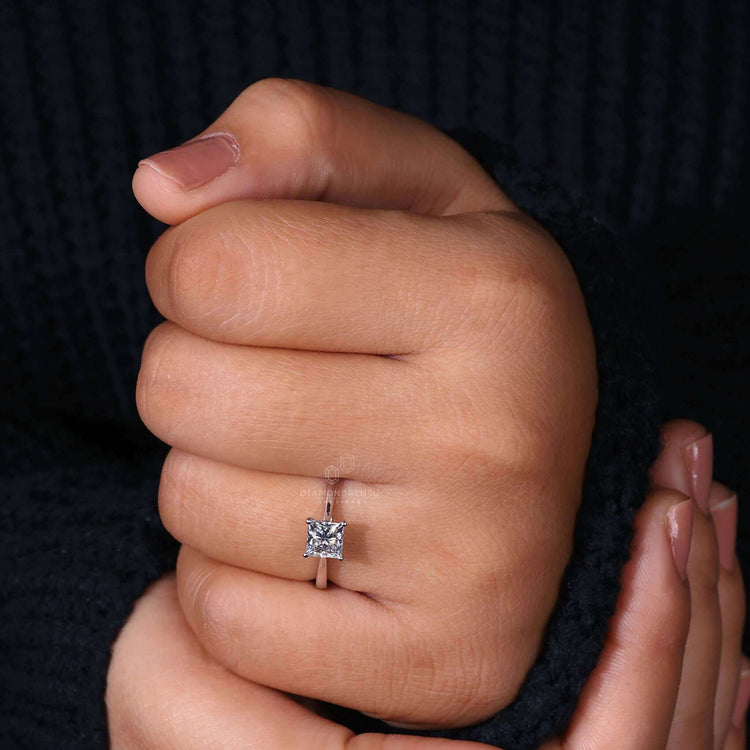 Princess cut solitaire ring with exceptional craftsmanship.