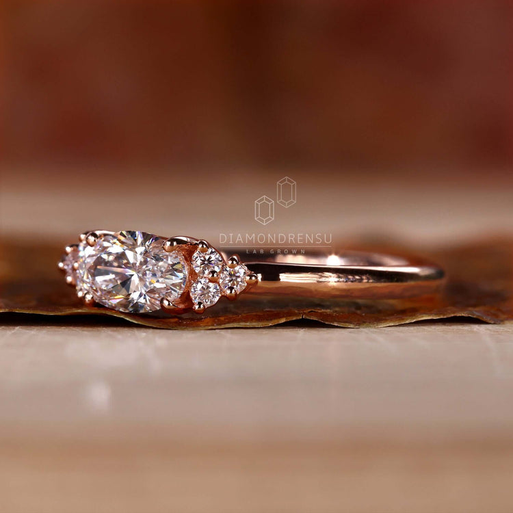 Gold oval diamond ring in a unique handmade style, perfect for engagement occasions.
