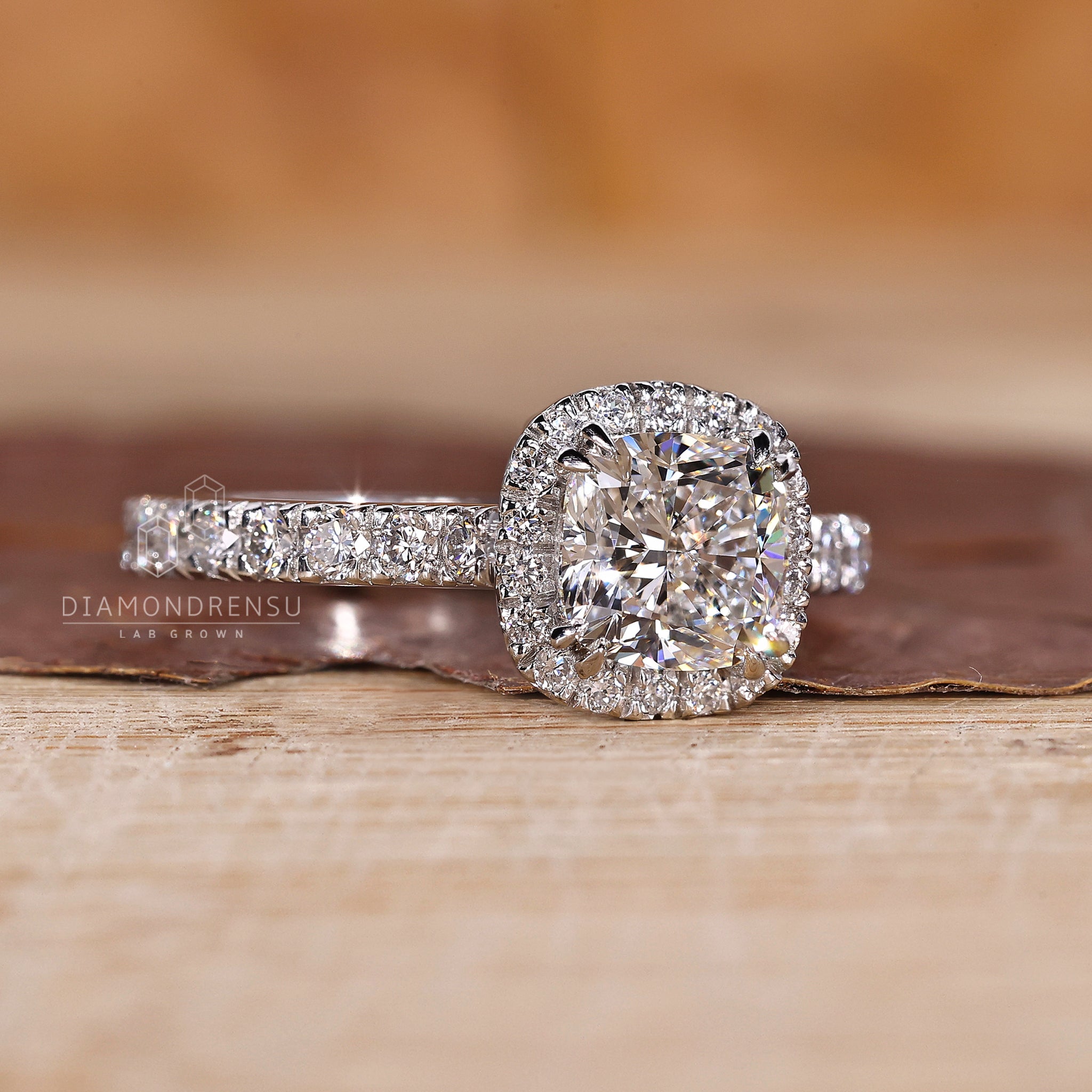 White gold engagement ring with hidden accents and double claw prong.

