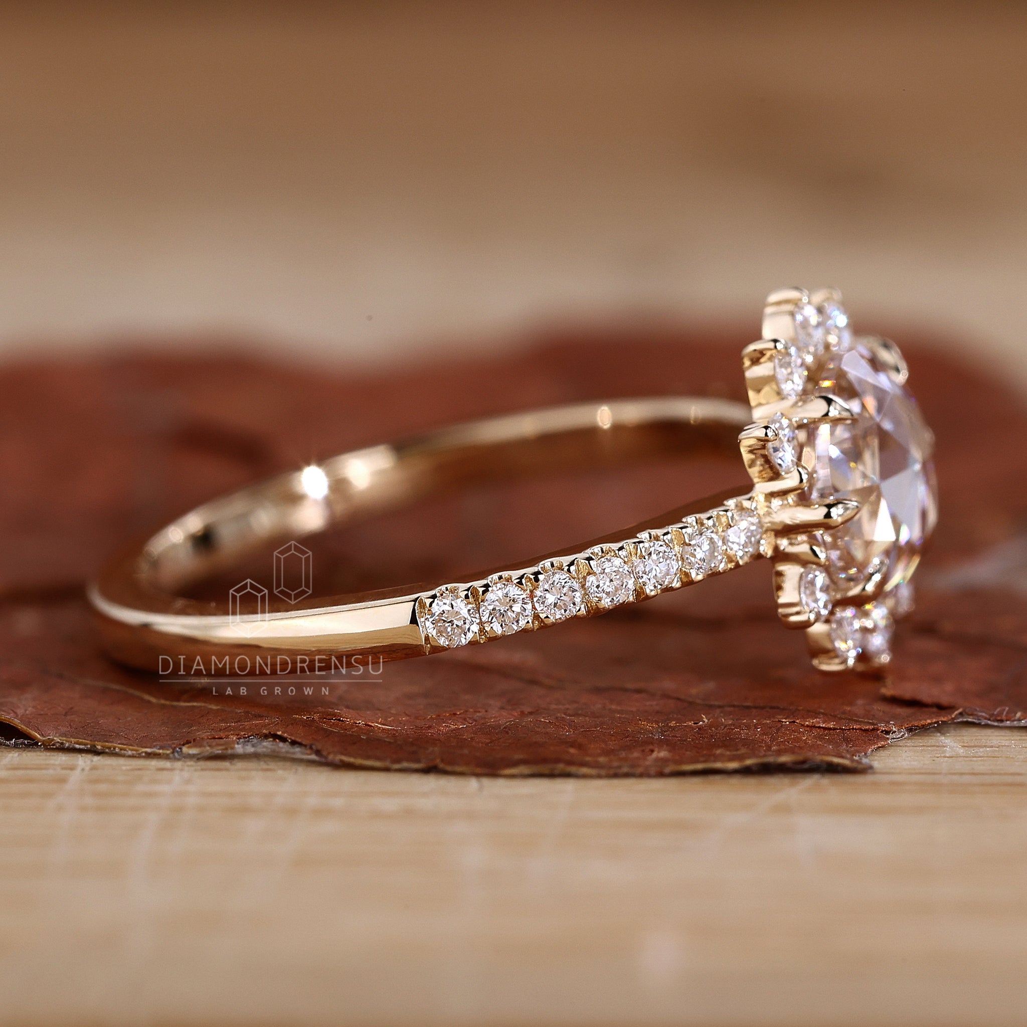 Elegant halo engagement ring with intricate diamond detailing.