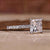 Princess cut pave engagement ring with intricate diamond detailing.