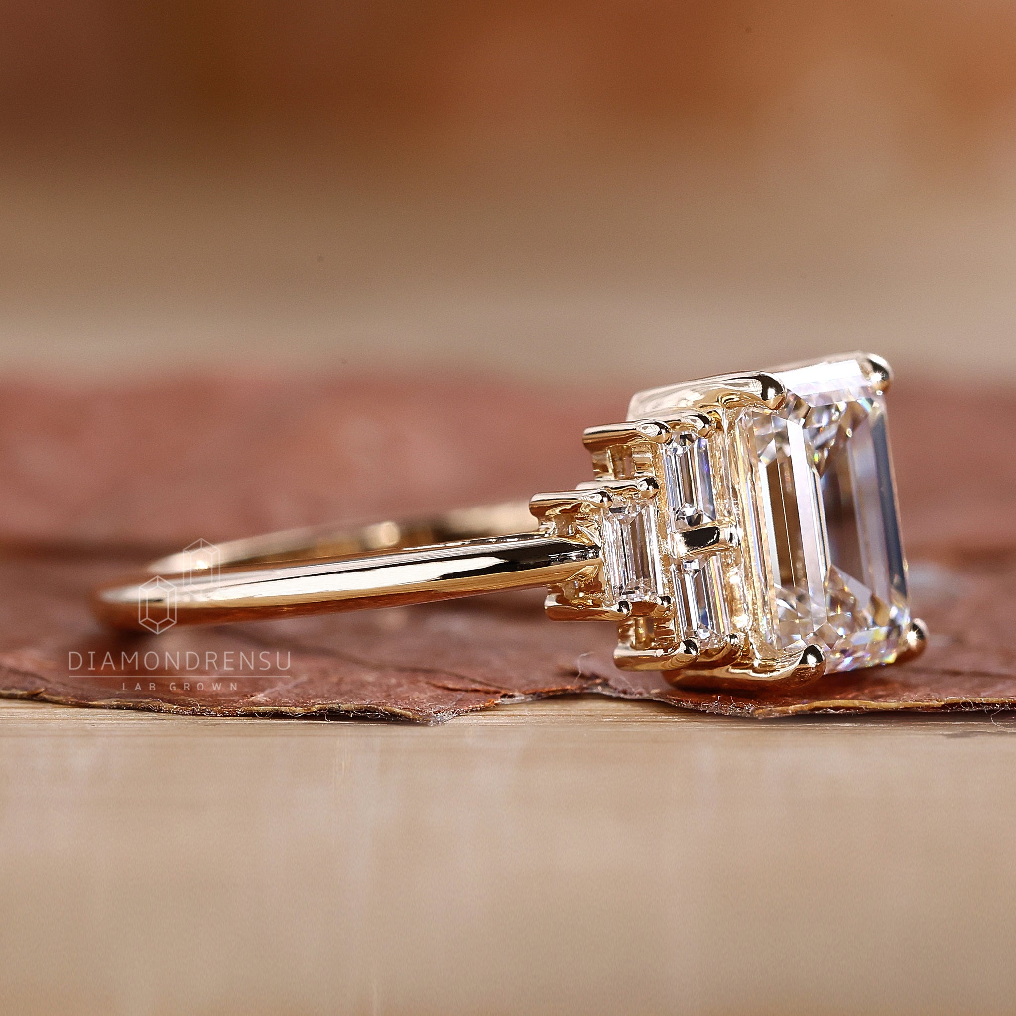Custom engagement ring with baguette side stones.

