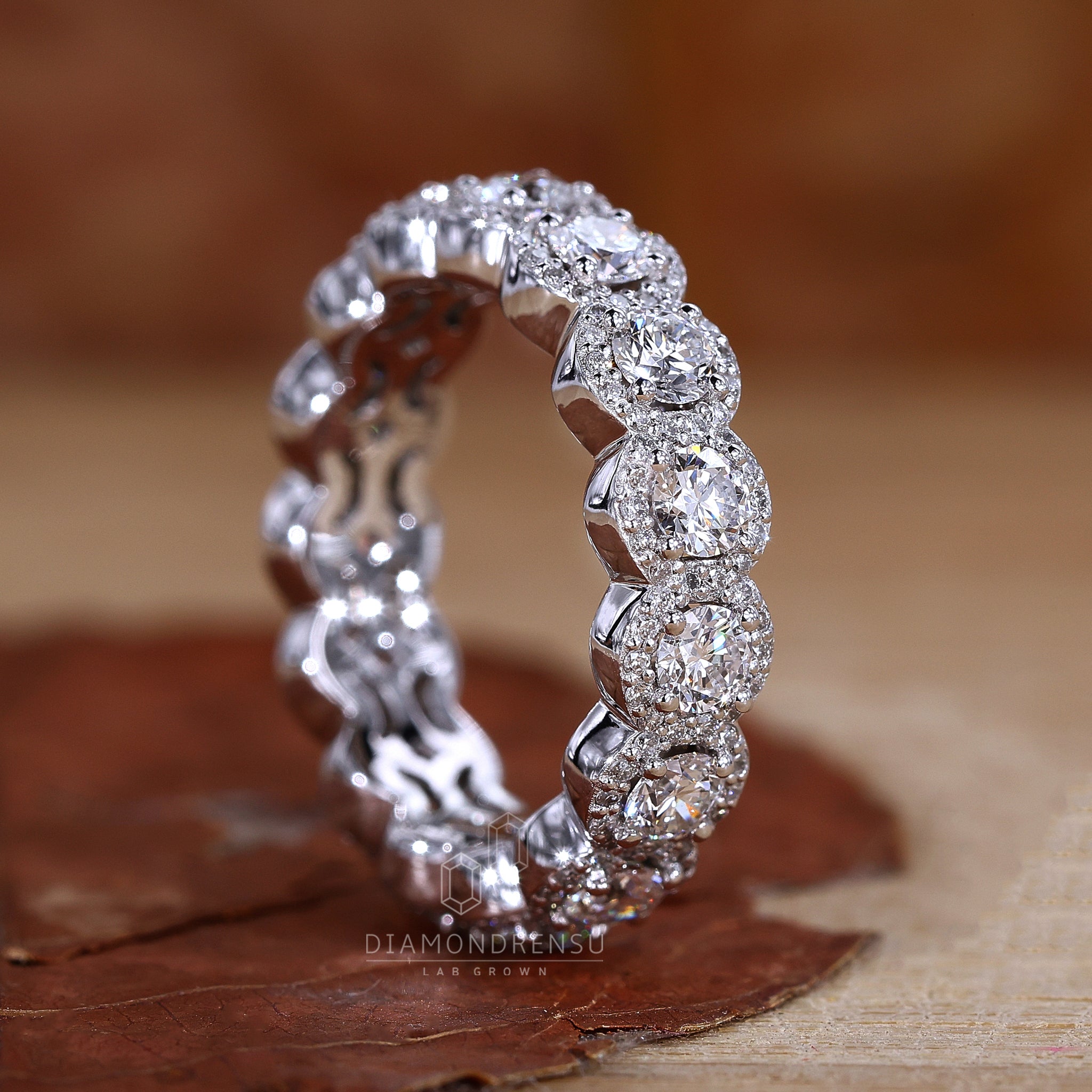 White gold wedding band with prong set halo diamonds

