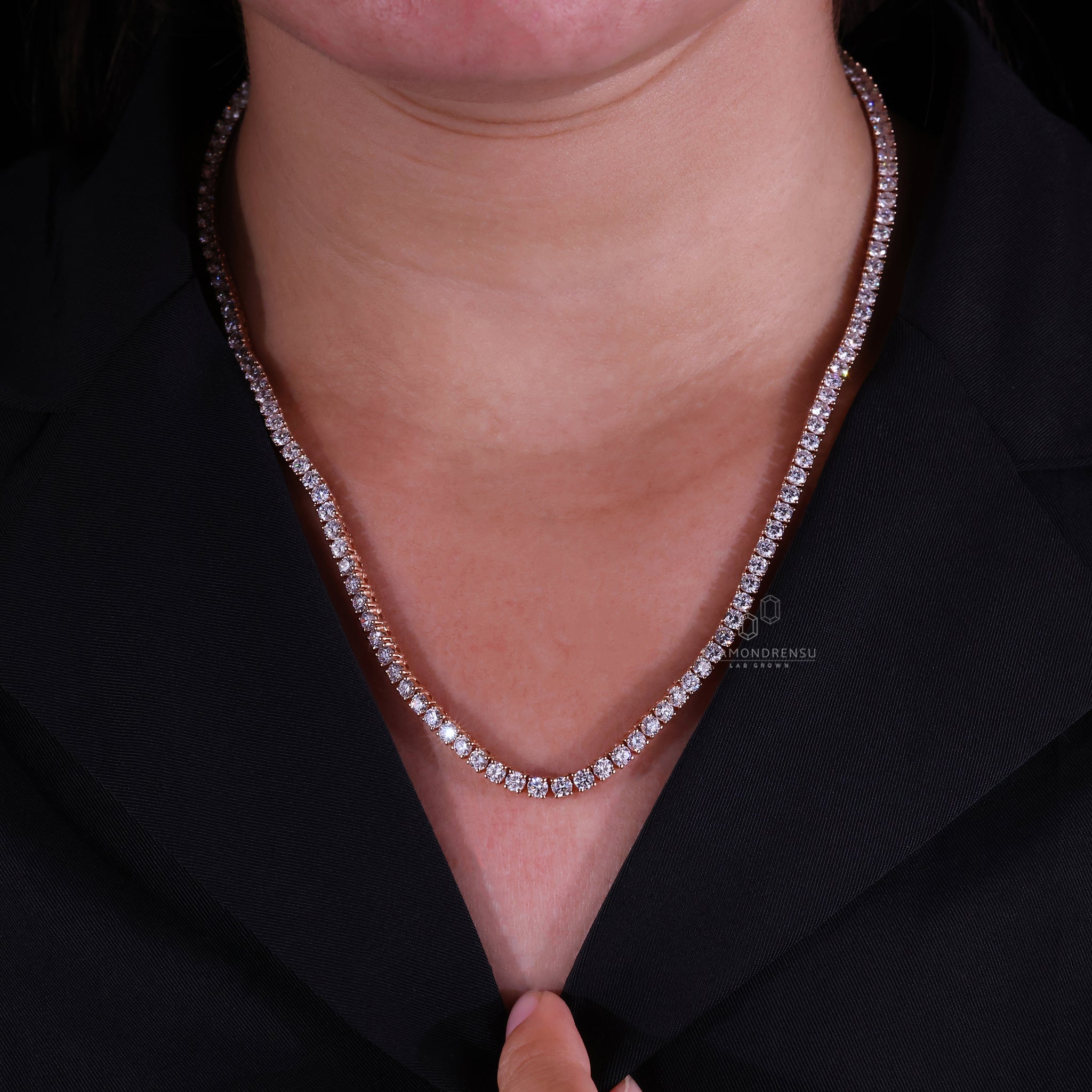 Rose gold necklace featuring round Lab Grown Diamond in a tennis style.
