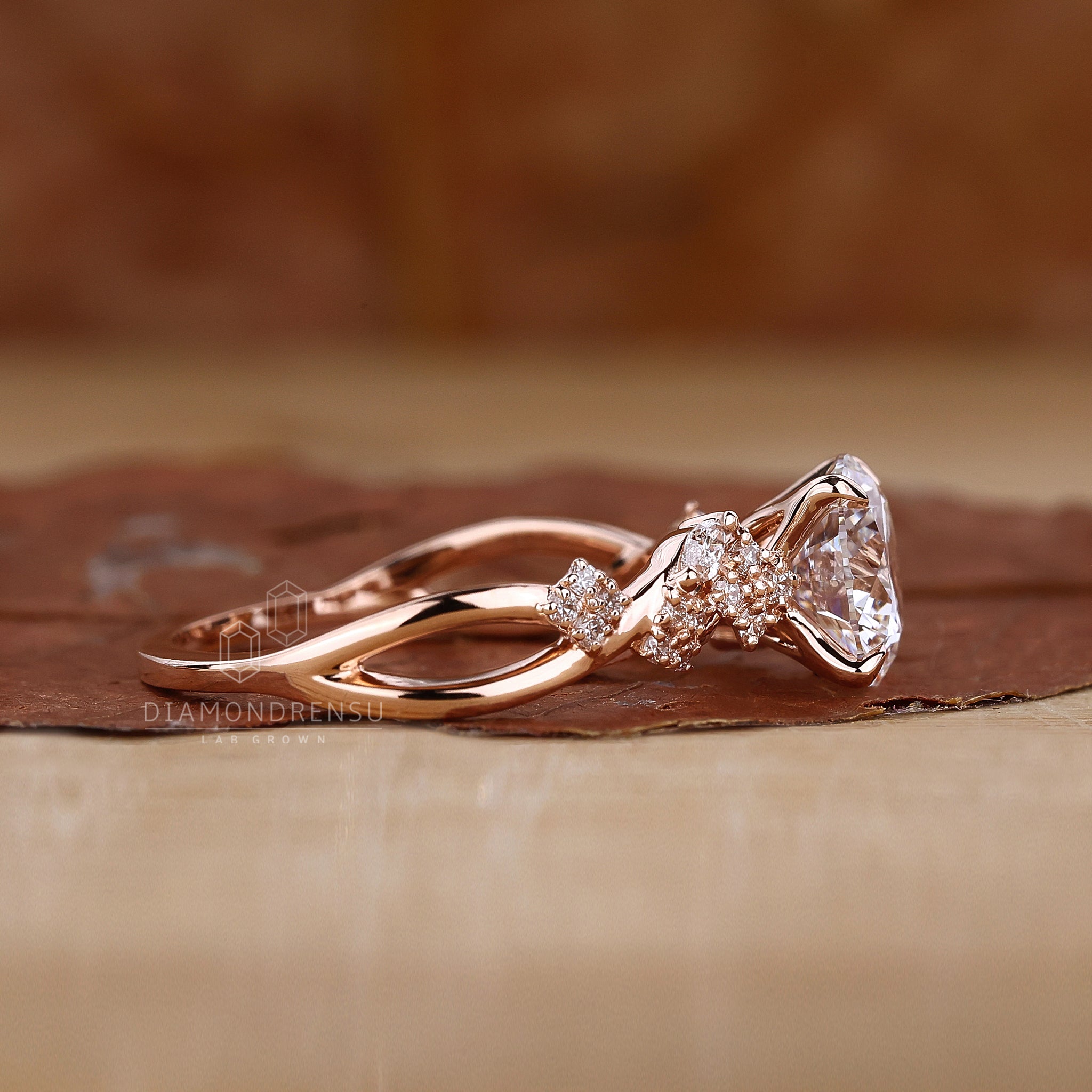 Nature inspired ring with marquise and round side stones.